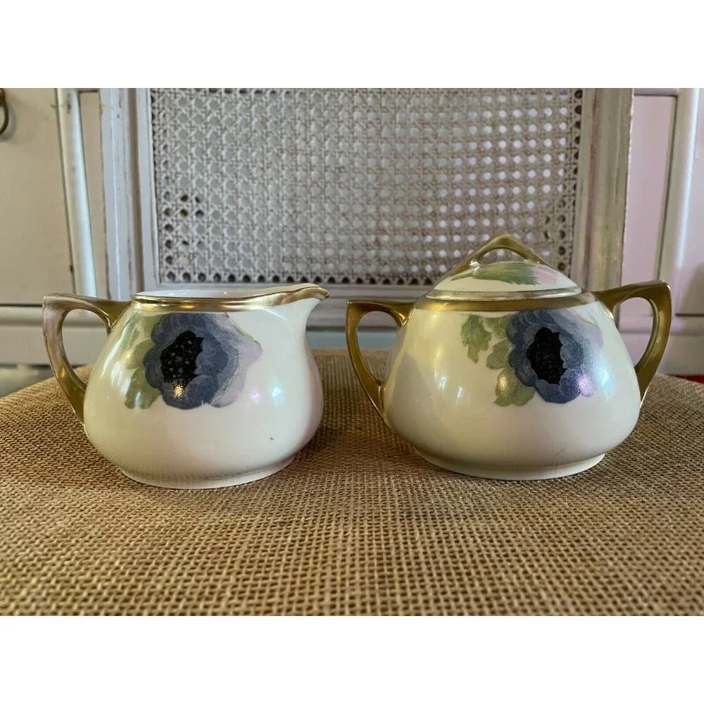 D & E.G. Royal Austria Handpainted Artist Signed Purple Floral Creamer & Sugar